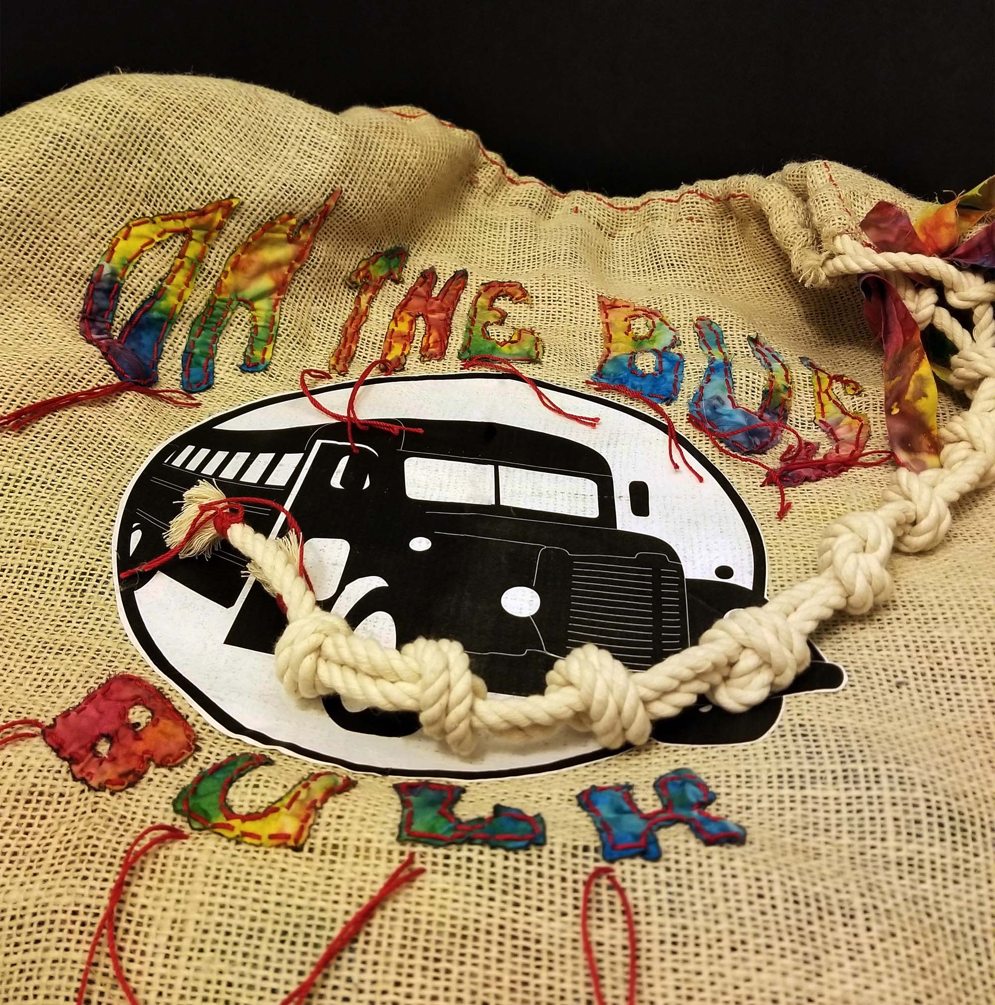 On the Bus Bulk, Loyalty Shopper large burlap tote/sack exterior view displaying the On the Bus bulk store logo image and typography