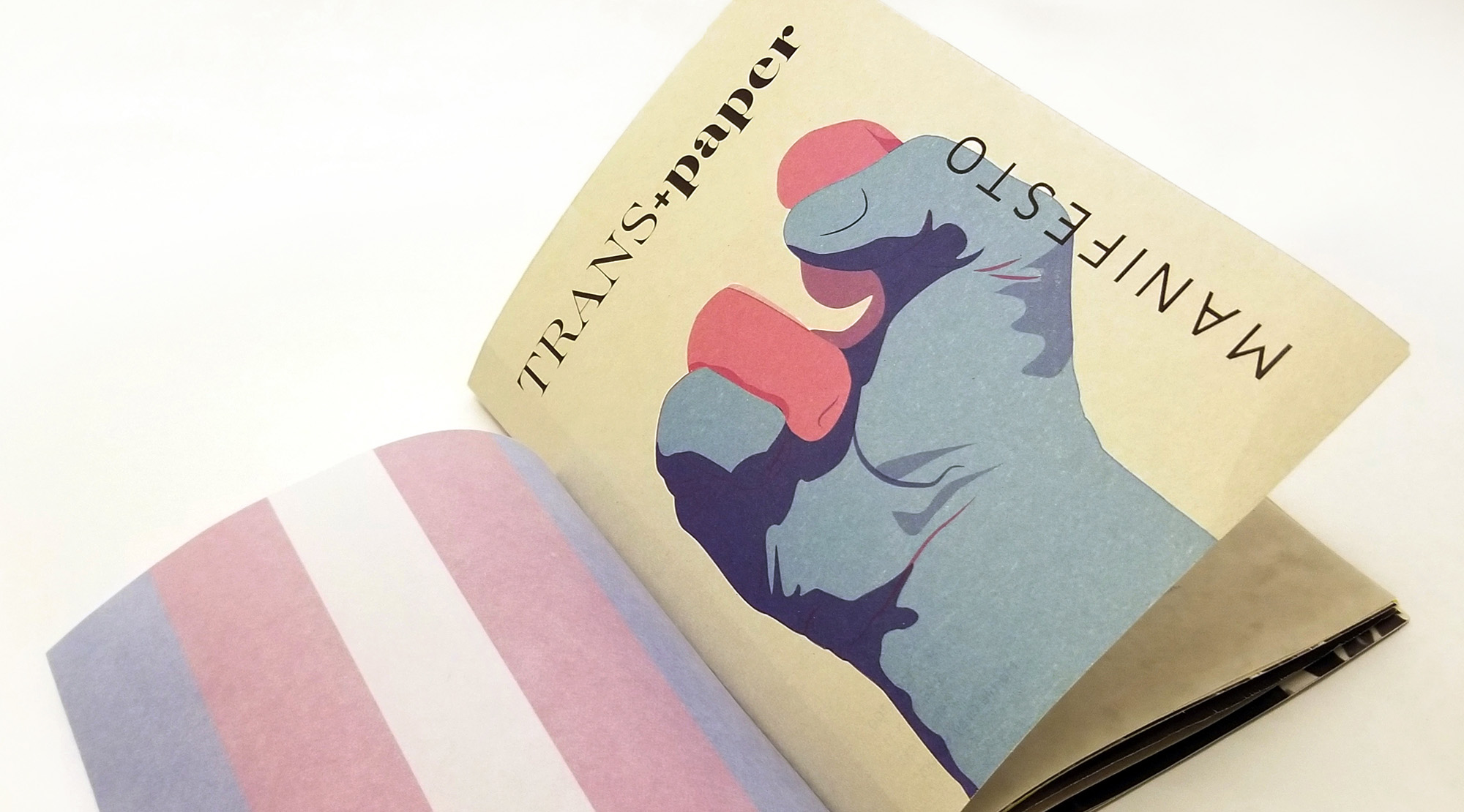 TRANSpaper Manifesto paper sample booklet cover featuring a raised fist with its fingers shaded in the color of the Transgender flag